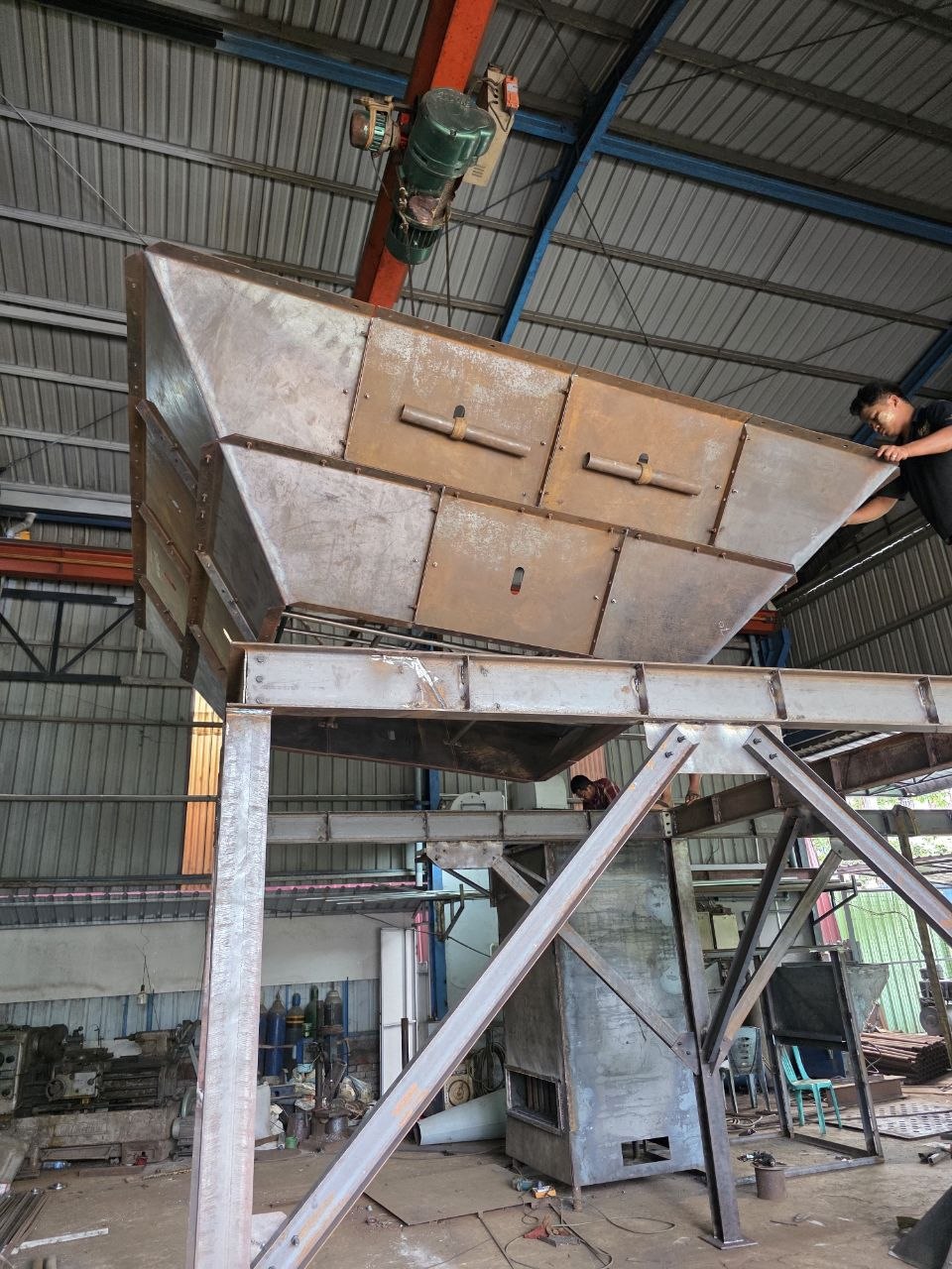 BPE team fabricating a large steel assembly in the workshop